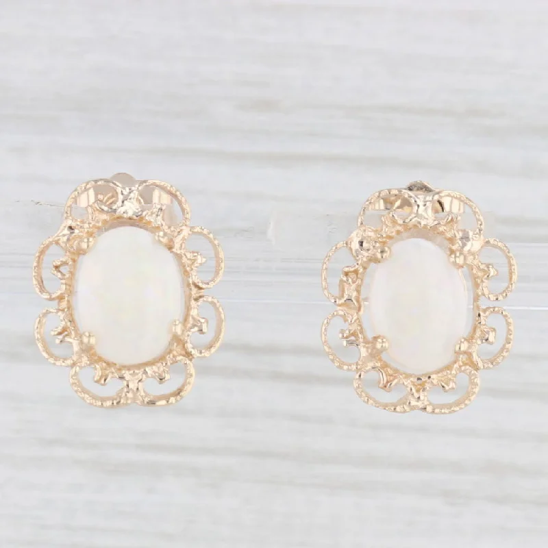 women's earrings with polished finish -Oval Cabochon Solitaire Opal Stud Earrings 14k Yellow Gold Filigree