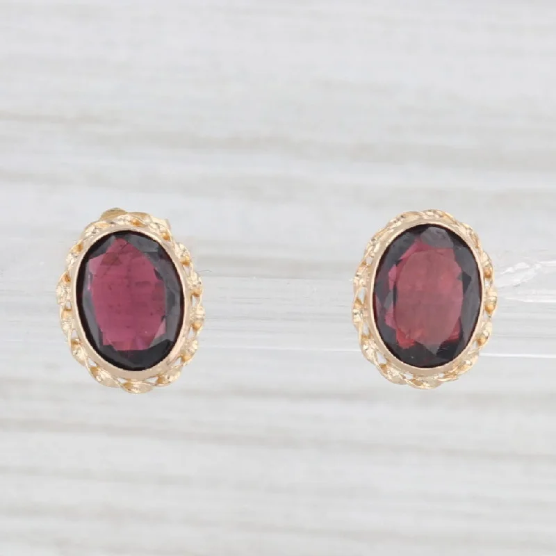 women's earrings with colored gemstones -3ctw Oval Garnet Stud Earrings 14k Yellow Gold