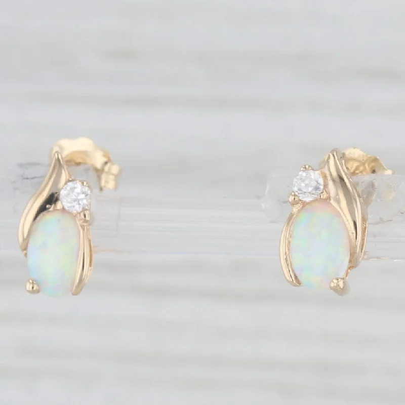 women's earrings with heart-shaped pearls -Lab Created Opal Cubic Zirconia Stud Earrings 10k Yellow Gold