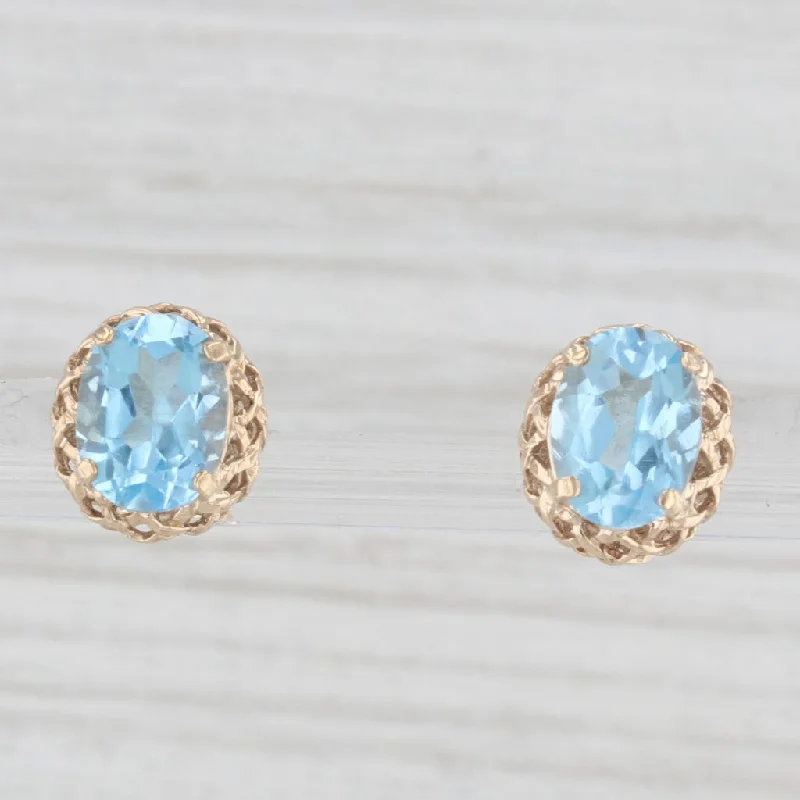 women's earrings with glamorous design -2.80ctw Oval Solitaire Blue Topaz Stud Earrings 10k Yellow Gold