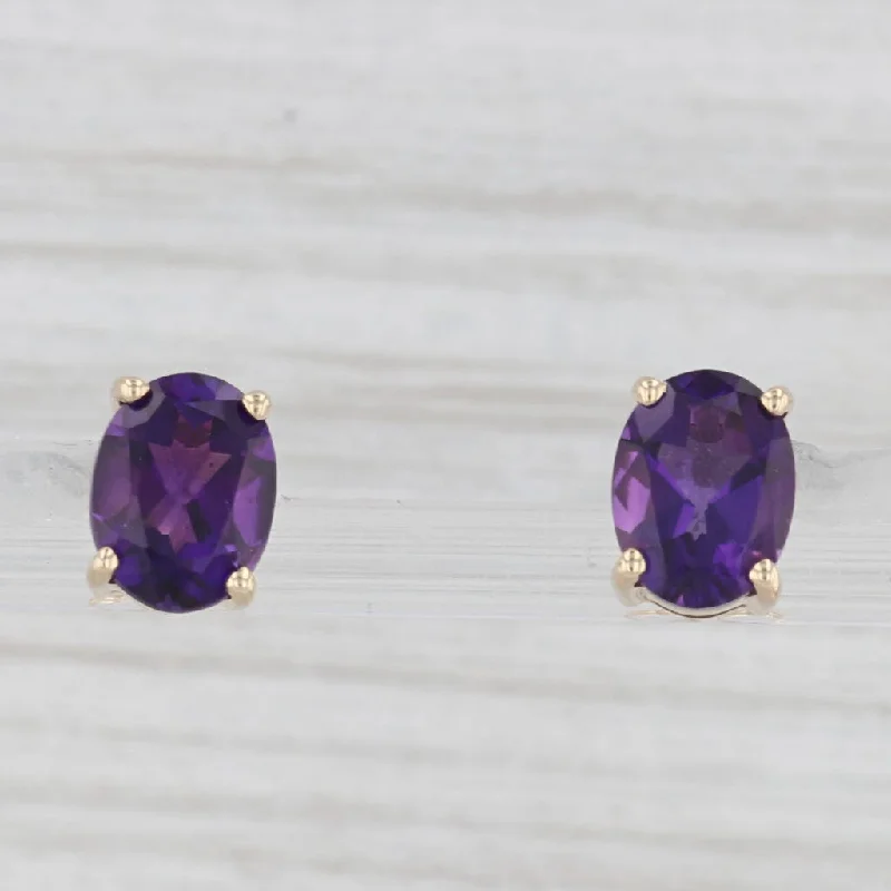 women's earrings with teardrop gemstones -2.20ctw Oval Solitaire Amethyst Stud Earrings 14k Yellow Gold