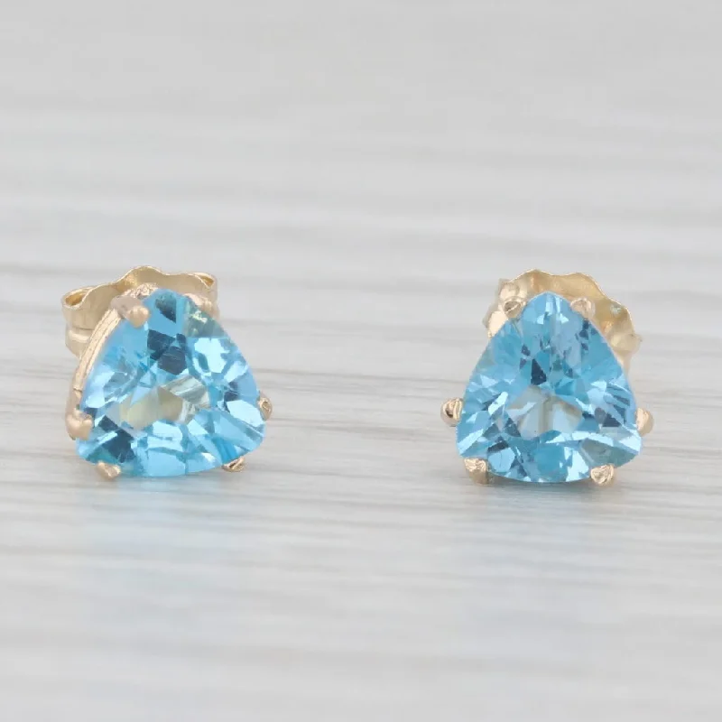 women's earrings with sparkling diamonds -2ctw Blue Topaz Stud Earrings 10k Yellow Gold Trillion Solitaires